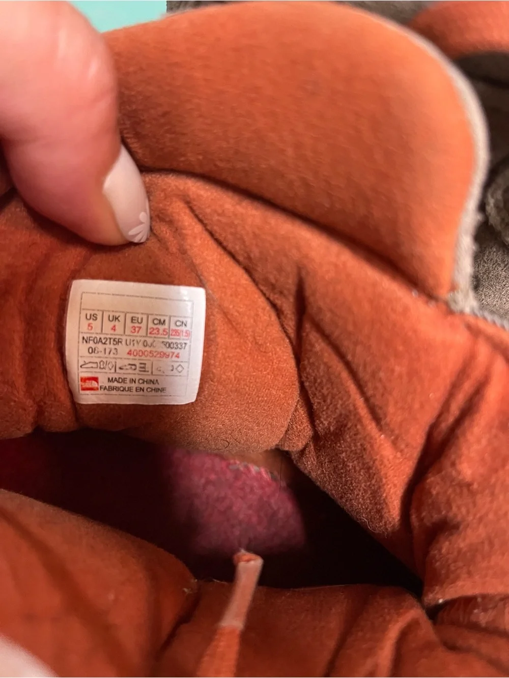 The North Face Kids Heat + Dry Insulated Boots in brown and orange